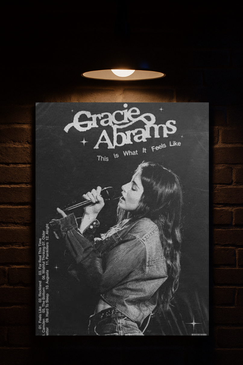 Poster of Gracie Abrams with a black and white photo of a woman singing, against a dark brick wall printed on velvet