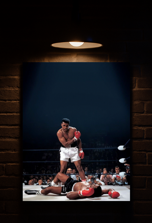 Framed picture of Muhammad Ali in a boxing ring with a dark brick wall background printed on velvet boxing