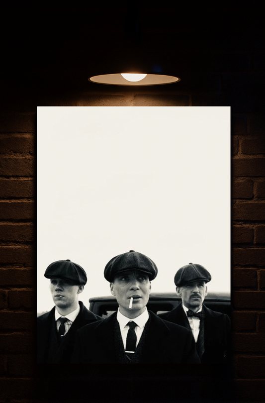 Black and white poster of Thomas Shelby, Arthur Shelby, John Shelby in suits and hats on a brick wall with a light fixture printed on velvet 