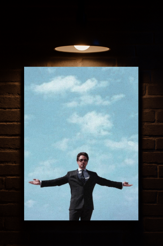 Man in a suit standing with arms outstretched against a blue sky with clouds, framed by a dark brick wall printed on velvet 